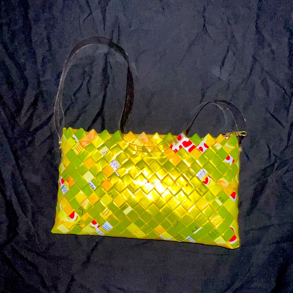 Major find! Very unique piece. Bright yellow, shiny, smooth material. Artsy.